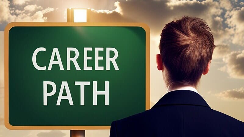 new graduate looks at a career path sign