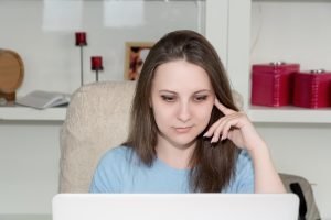 girl in front of computer finds a job from home