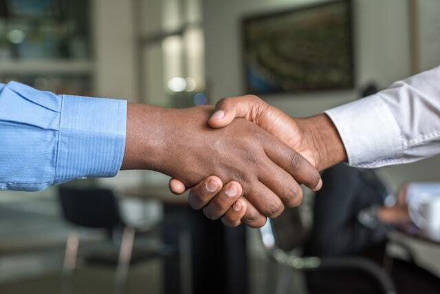shaking hands at interview after job certification