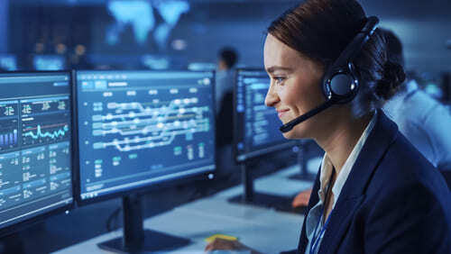 computer support specialist person wears a headset and talks to a customer