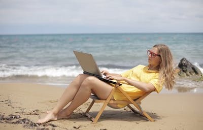 freelance career person working on beach